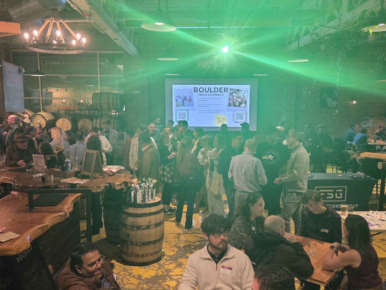 Tech professionals networking at a Boulder Tech Connect monthly happy hour at a Boulder brewery